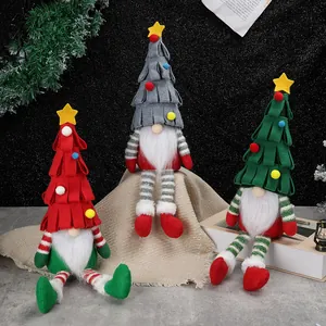 Three long-legged Christmas gnomes with tiered tree hats and star toppers for home decor