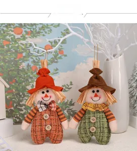 Detail view of colorful autumn scarecrow hanging ornaments with burlap texture and felt hats