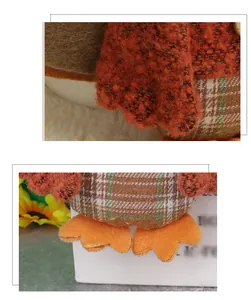 Detailed close-up of thanksgiving fabric turkey showing orange plush and plaid cotton texture