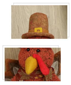 Detail of harvest turkey plush featuring top hat and maple leaf scarf decoration