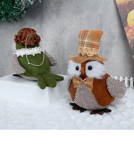Detailed view of handmade owl fabric ornaments with lace and plaid for festive decoration