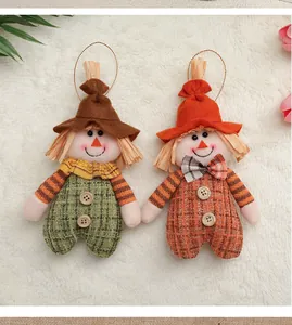 Close-up of scarecrow ornaments with felt and plaid fabric for Thanksgiving decor