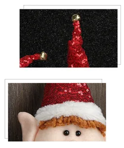 Detail of red sequined Christmas doll hat with a small golden metal bell on top