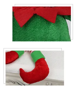 Detail of soft plush Christmas elf doll featuring red and green striped fabric textures