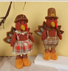 Detail of plush turkey dolls with checkered fabric for Thanksgiving home decor