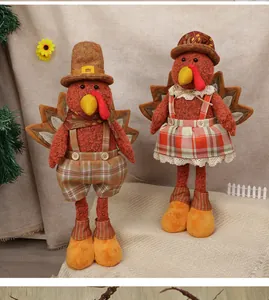 Detail of harvest turkey plush dolls with plaid outfits for Thanksgiving home decoration