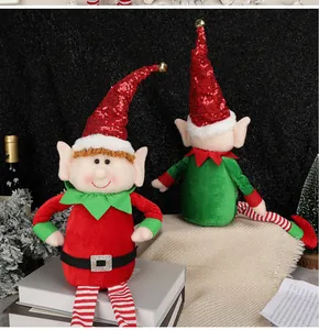 Detail of Christmas elf plush with sequins and bell on a festive decorative display