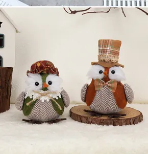 Detailed close-up of handmade fabric owl ornaments with rustic tweed and lace textures
