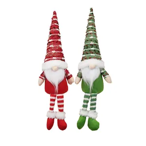Pair of Christmas faceless gnomes with long legs and knitted hats for home decor