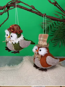 Detail of owl fabric hanging ornaments with felt and lace texture on branches