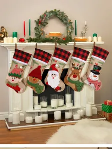 Set of five burlap Christmas stockings with 3D appliques hanging on a white fireplace