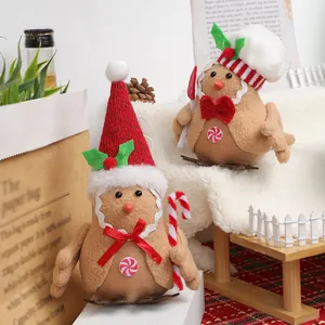 Oiseaux en peluche pain d'épices avec chapeaux de Noël et cannes de bonbon décoratifs