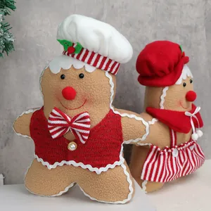 Standing plush gingerbread man and woman dolls for Christmas tabletop decoration