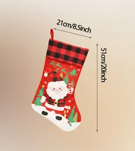 Detailed view of red and black plaid Christmas stocking with Santa print and 51cm size specs