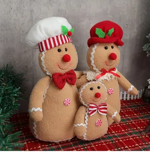 Tres muñecos de peluche de jengibre en diferentes tamaños para decoración navideña