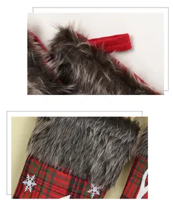 Detail of red and green plaid Christmas stocking with gray plush cuff and snowflake