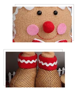 Λεπτομέρεια από λούτρινο ανθρωπάκι gingerbread με κόκκινο φιόγκο και λευκά σχέδια