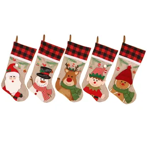 Set of 5 Christmas stockings featuring Santa and reindeer with buffalo plaid cuffs