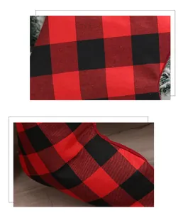 Macro detail of red and black buffalo plaid fabric texture on a Christmas stocking