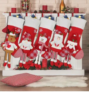 Detailed set of 5 red plush Christmas stockings hanging on white fireplace mantle