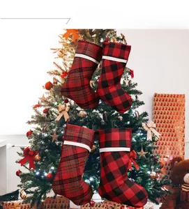 Classic plaid Christmas stockings set hanging as festive decorations on a tree