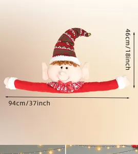 Detail of Christmas elf tree topper with red striped hat and size markings 46cm by 94cm