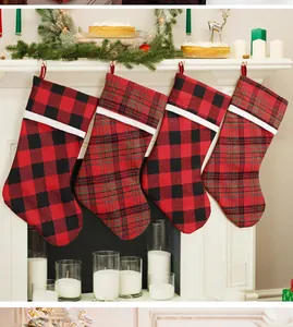 Cozy Christmas stockings with buffalo check and tartan hanging on a festive fireplace mantle