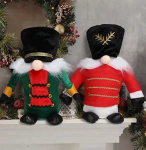 Detailed view of two Christmas nutcracker faceless gnomes on a decorated fireplace mantle