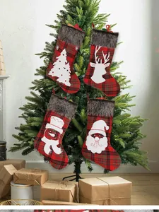 Detailed view of 4-pack plaid Christmas stockings with faux fur trim hanging on a tree