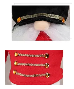 Close-up of Christmas gnome nutcracker with gold trim and amber gem detail