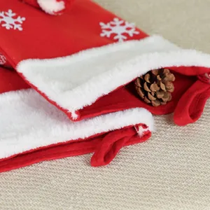 Classic red Christmas stockings with white snowflakes, faux fur trim and hanging loops