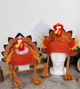 Detailed view of knitted turkey hats with felt feathers for Thanksgiving party decor