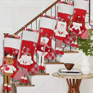 Set of 5 plush Christmas stockings with 3D Santa and Reindeer hanging on stairs
