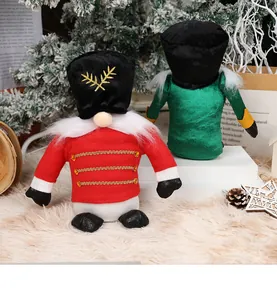Close-up of plush Nutcracker gnomes in velvet fabric with intricate gold embroidery details