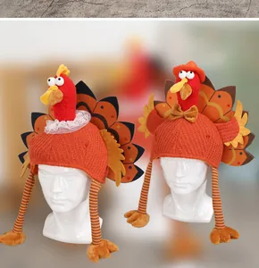 Detail of knitted turkey hats with lace collar and bow tie for Thanksgiving party