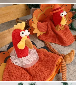Detail of knitted turkey hats with red velvet and orange yarn for Thanksgiving party decor