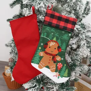 Large festive Christmas stockings with gingerbread man print hanging on a decorated tree