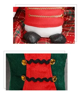 Close-up of nutcracker doll details with gold braids, orange gems, and velvet fabric
