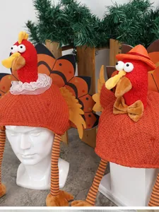 Detail of knitted Thanksgiving turkey hats with lace collars and tiny top hats