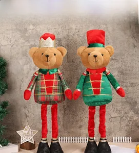 Detail of plush Christmas soldier bears with telescopic legs and festive outfits decoration