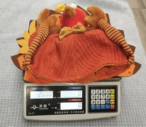 Close-up of a plush turkey hat weighing 200g on a digital scale for Thanksgiving decor