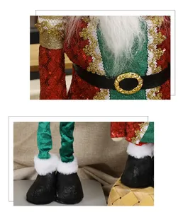 Dettaglio bambola schiaccianoci di Babbo Natale con paillettes rosse e fibbia dorata