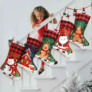 Set of 5 large Christmas stockings with reindeer and snowman hanging on a white staircase