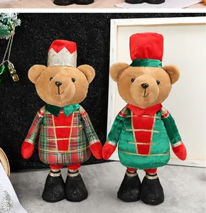 Close-up of Christmas teddy bear plushies in festive nutcracker soldier costumes