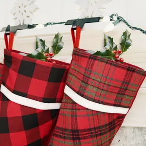 Classic plaid Christmas stockings in buffalo and Scottish patterns for home mantel decor