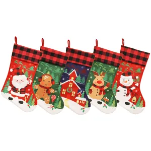 Set of 5 Christmas stockings with buffalo plaid tops and festive holiday characters