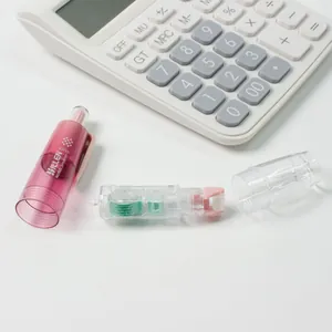 Macro detail of a 6mm refillable dot glue pen showing the internal green gear and pink shell