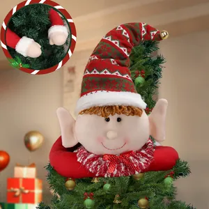 Christmas elf tree topper with red and green knit hat, golden bell, and matching arm sleeves