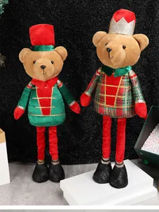 Detail of plush Christmas bear soldiers with telescopic legs and glitter crowns decoration