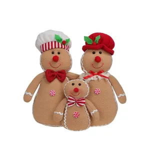 Juego de tres peluches de hombre de jengibre navideño con sombreros y lazos festivos